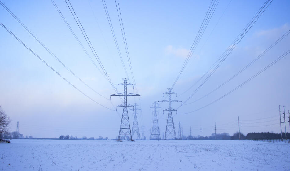 Electricity pylons against sky